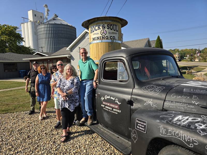 (From left) Utica Police's Jason Quinn; Jamie Turczyn, village of Utica; Debra Krizel, village trustee; Jamie Wallace, Christy Donahue and Village President David Stewart show off the new truck at the Rock and Soul in Utica.