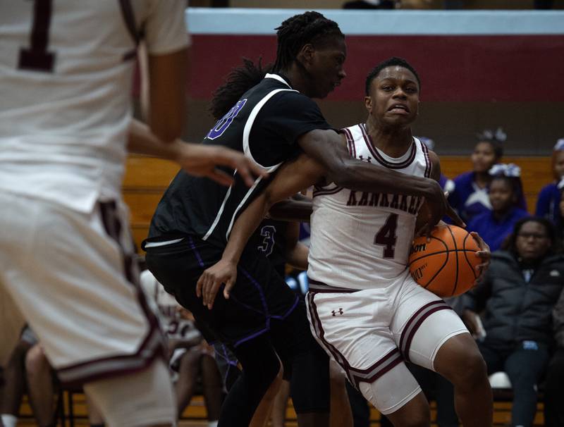Kankakee's Myair Thompson, right, makes a break toward the net as Thorton's Adrian Johnson, left, guards in a game on Friday, December 12, 2025.