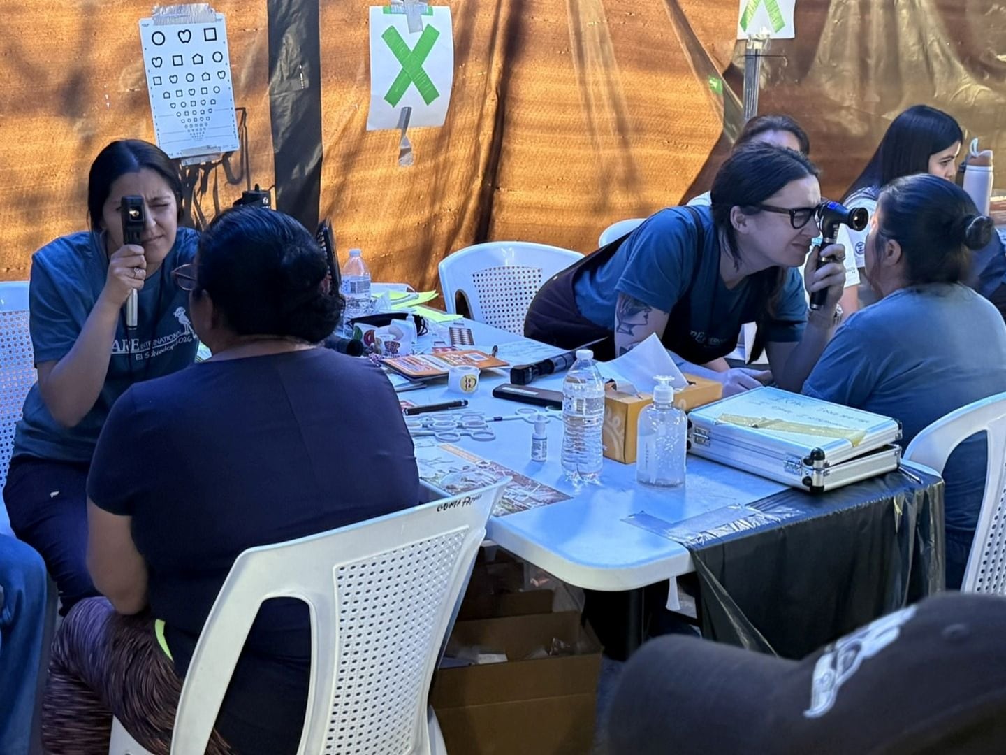 Volunteers with I Care International perform eye exams during their recent trip to Guatemala.