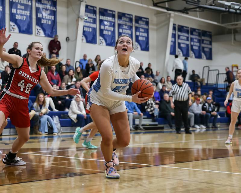 Nazareth's Danni Scully (23) approaches the rim during varsity basketball game between Deerfield at Nazareth.  Jan 23, 2023.