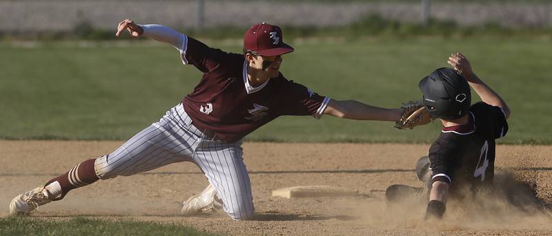 Richmond-Burton's Dylan Radke tags out Marengo's Drew Johnson as he tries to steal second bace during a Kishwaukee River Conference baseball game on Thursday, April 25, 2024, at Marengo High School.