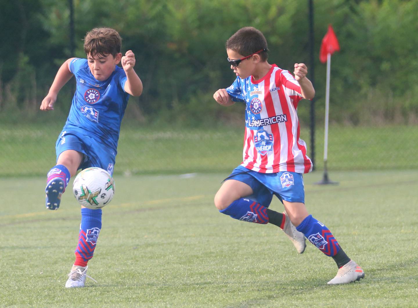 AJ Anderson 10 of Princeton, (left) plays against a defender during the All American Youth Soccer tournament on Sunday, July 9, 2023 in Gatlinburg Tenn. Anderson scored three goals in four games and had over a dozen assists. The camp requires kids to be nominated by a coach and have a video submission to attend. Players from all over the country participated in the camp.