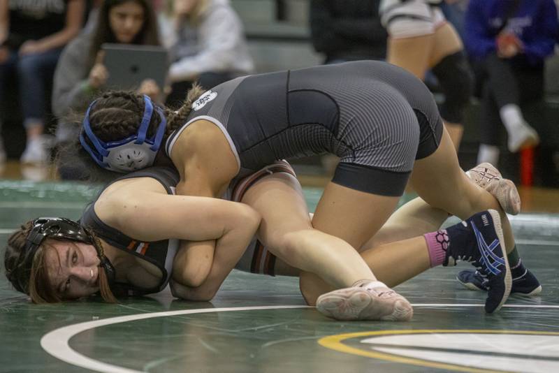 Eliana Paramo of Joliet Central High School looks to pin Ashlyn Strenz of Sandwich High School. Paramo would go on win the sectional championship at Geneseo High School on February 10, 2024.