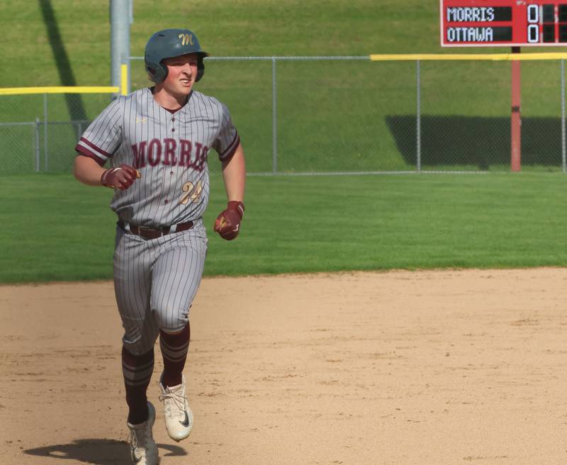 Morris's Carter Snyder rounds third base after hitting a three-run homeer against Ottawa on Monday, April 20, 2026 at Ottawa High School.