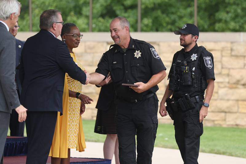 Elwood Police department are recognized at the National Cemetery Administration 50th Anniversary ceremony at the Abraham Lincoln National Cemetery in Elwood on Saturday, July 29.