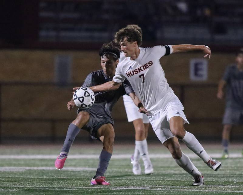 Naperville North's Noah Radeke (7) battles for possession during soccer match between Naperville North at Morton.  Sept 21, 2023.