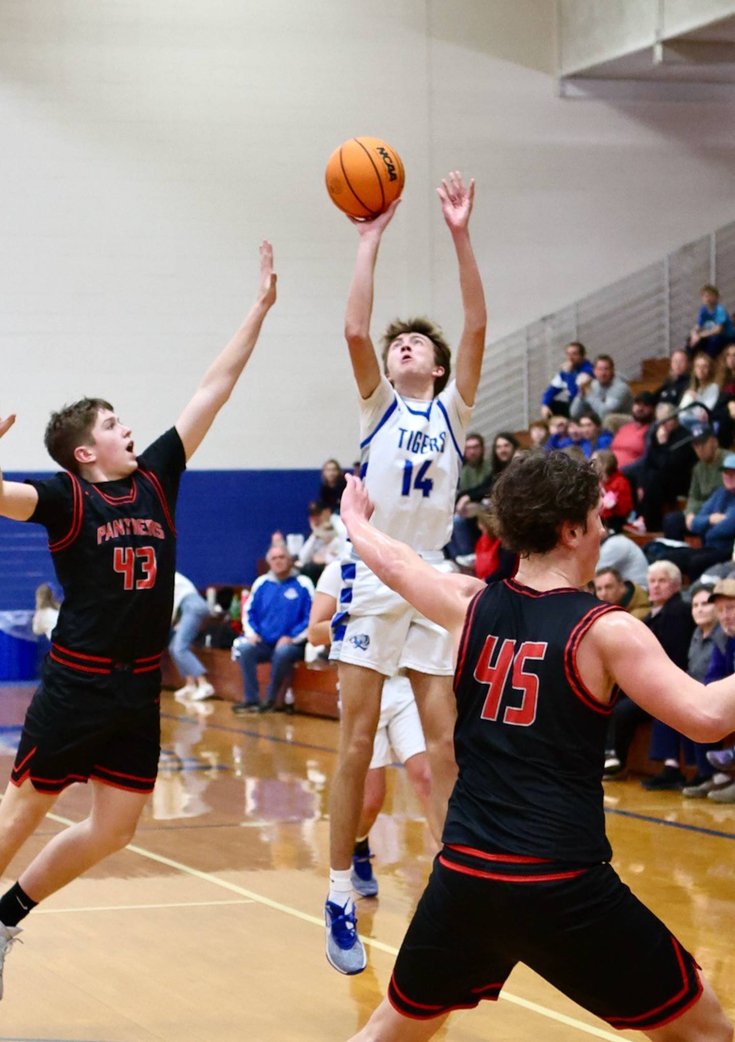 Princeton junior Jackson Mason shoots and makes a 3-pointer Friday night at Prouty Gym four days after losing his dad, Pat.