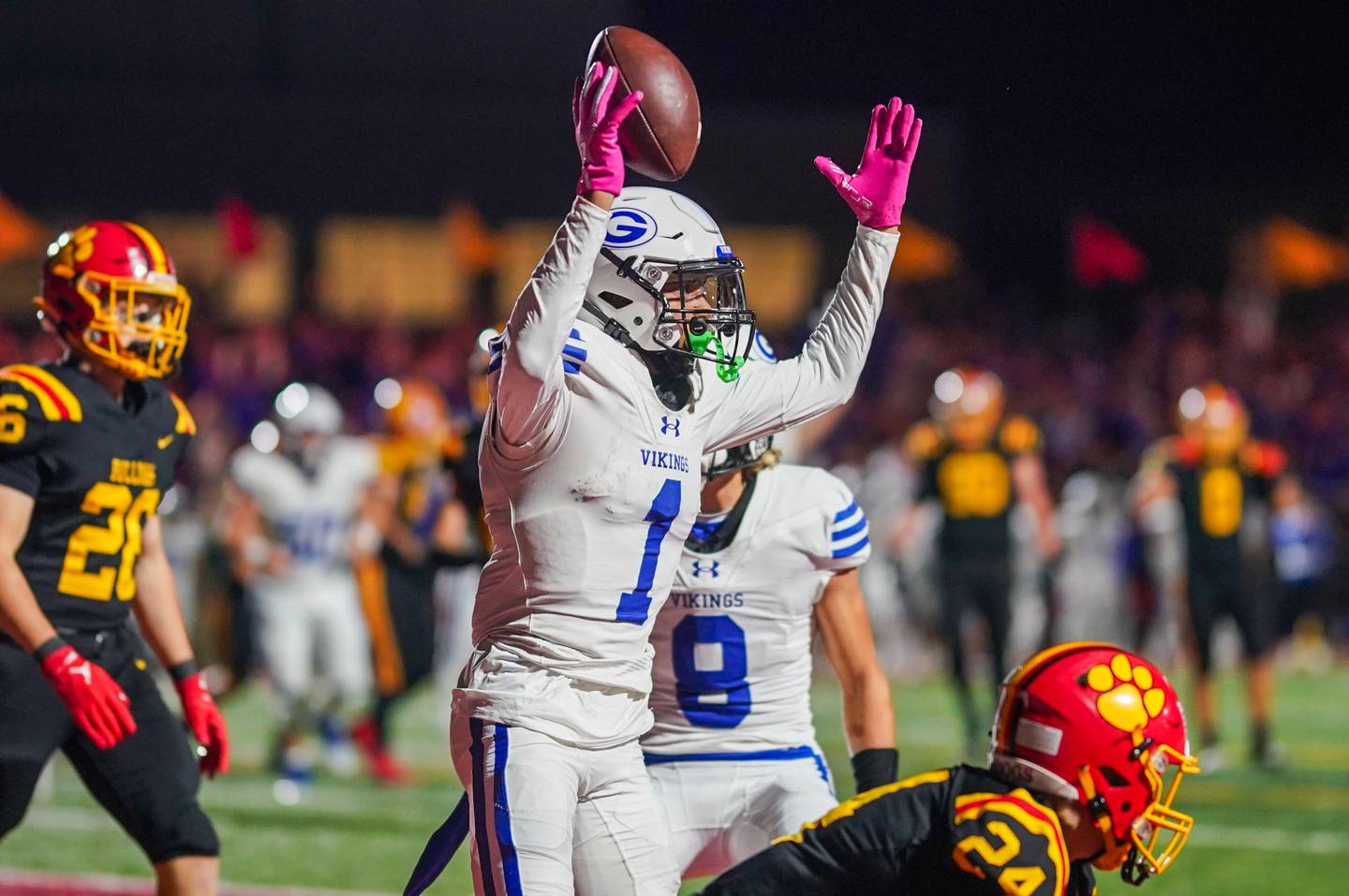 Geneva’s Talyn Taylor (1) reacts after scoring a touchdown against Batavia’s Micah Johnson (24) during a football game at Batavia High School on Friday, Oct. 4, 2024.