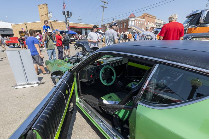Visitors to Amboy’s Depot Days stop by to check out Todd Carlson's high-powered 1971 Dodge Charger on Sunday, Aug. 25, 2024. Hundreds of cars, trucks and bikes lined the downtown streets for the annual festival.