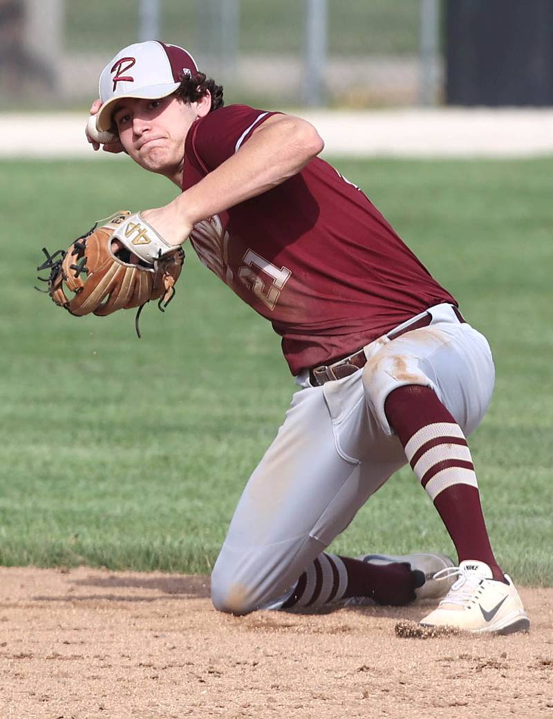 Morris' Nazim Baftiri throws from a knee after making a diving catch during their game against Sycamore Tuesday, May 9, 2023, at the Sycamore Community Sports Complex.