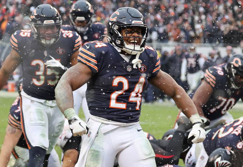 Chicago Bears running back Khalil Herbert celebrates his touchdown during their game against the Atlanta Falcons Sunday, Dec. 31, 2023, at Soldier Field in Chicago.