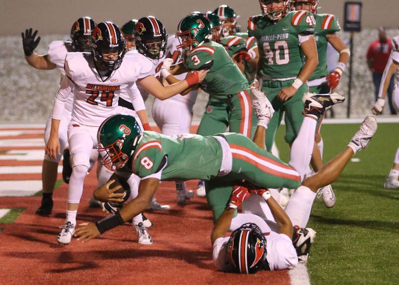 L-P quarterback Marion Persich dives into the end zone to score a touchdown against Metamora on Friday, Sept. 5, 2025 at Howard Fellows Stadium.