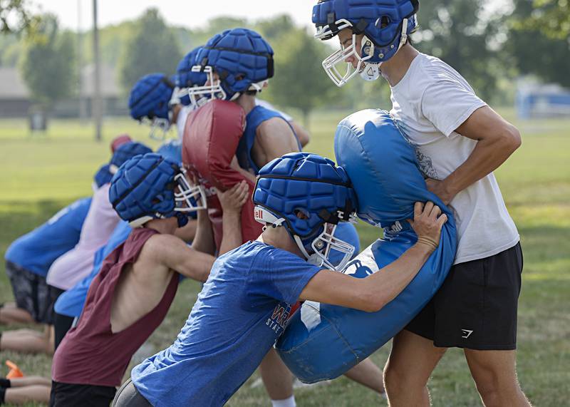 Newman players run through drills during first day of football practice Monday, August 7, 2023.