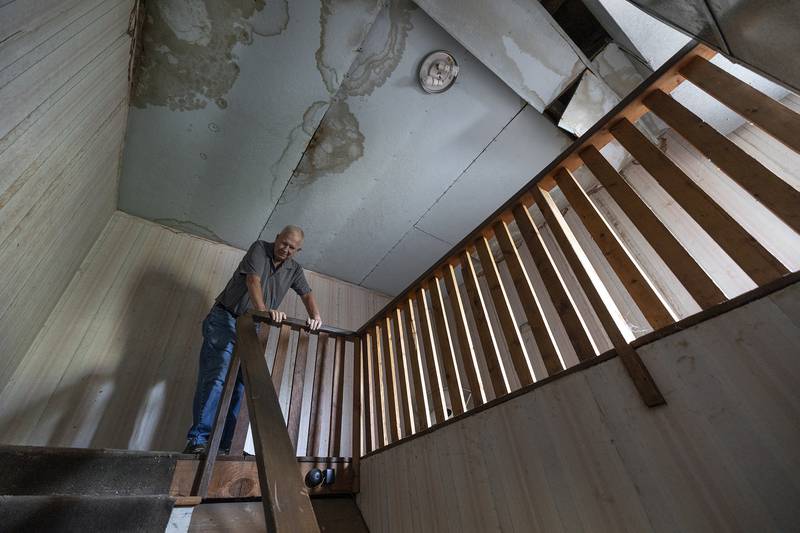 First United Methodist janitor Ken Heerdt shows off the cramped route the heavy stone would have made as it was retrieved from the bell tower.