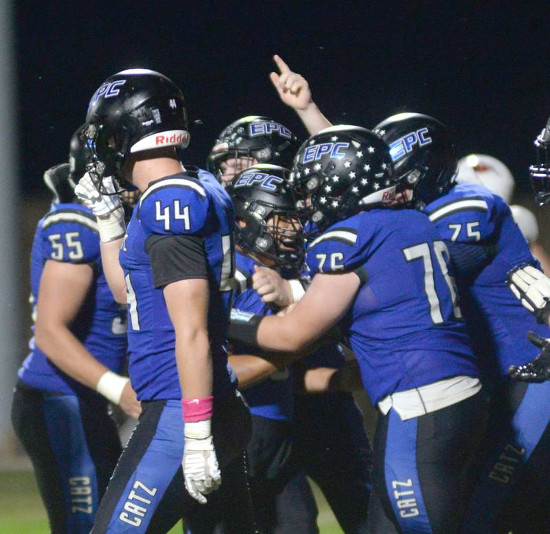 Eastland-Pearl City's kicker Oscar Ugalde-Sanchez (center) celebrates with his teammates after scoring an extra point against Forreston on Friday, Oct. 3, 2025 at Pearl City High School.