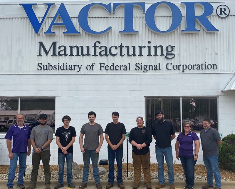 Illinois Valley Community College welding instructor and program coordinator Tony Sondgeroth (left) with Vactor Manufacturing welders and former IVCC students Austin Stanley, Jacob Wilson, Rowan Hampel, Mason Adkins, Trevor Mooney, Clayton Cole, IVCC welding instructor Theresa Molln and Vactor Production Manager Matt Bouley.