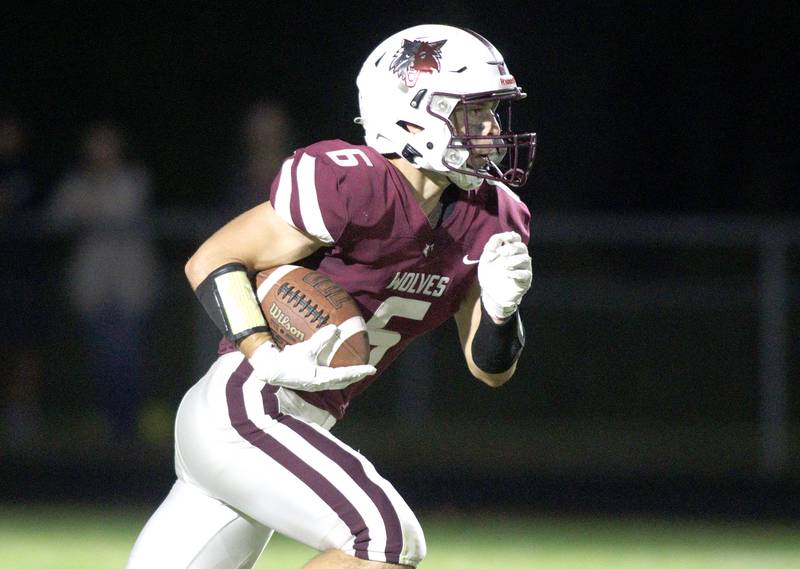 Prairie Ridge’s Luke Vanderwiel runs the ball against Huntley in varsity football at Crystal Lake Friday night.