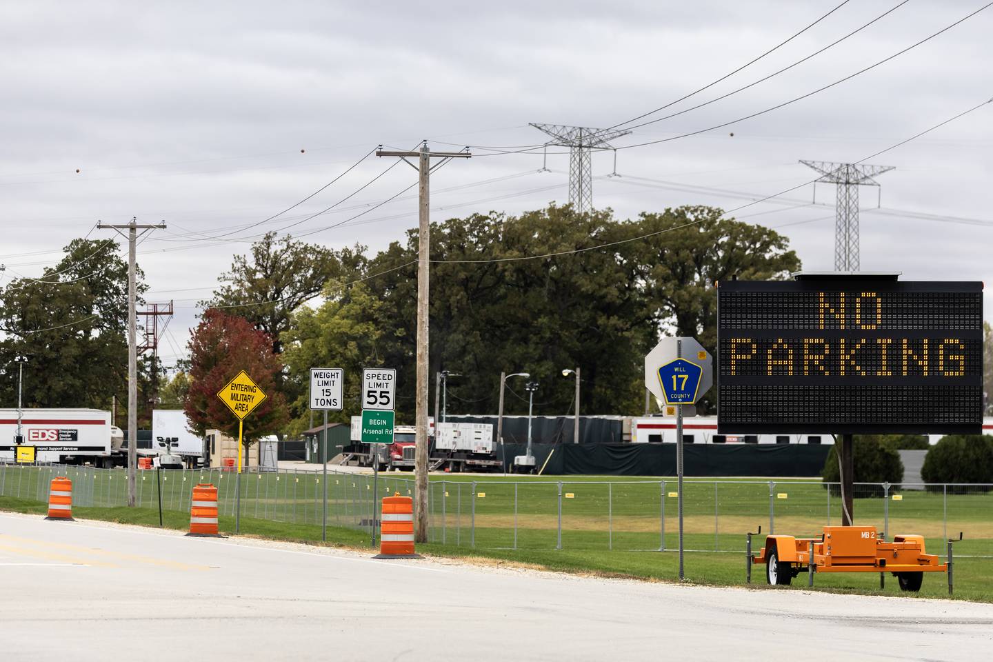 A ‘No Parking’ sign and orange barrels are positioned along Arsenal Rd. in Elwood in the area near the Joliet Area Army Reserve Training Center base, which is currently hosting National Guard troops, as pictured on Oct. 22, 2025.