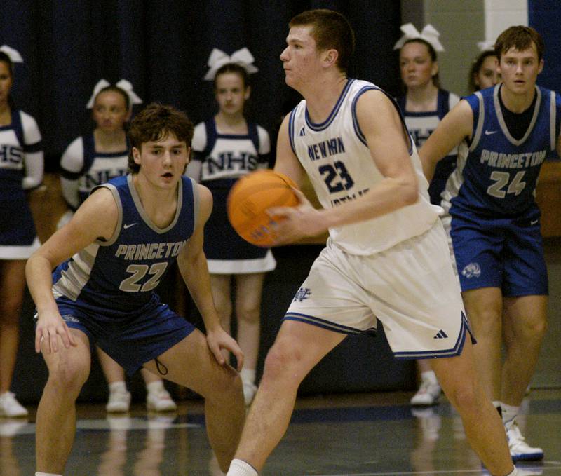 Newman's John Rowzee passes the ball around defender Deacon Gutshall.  1-3 Princeton played Newman (3-0) in a conference game. The matchup took place at Newman High School on Friday, December 5, 2025.