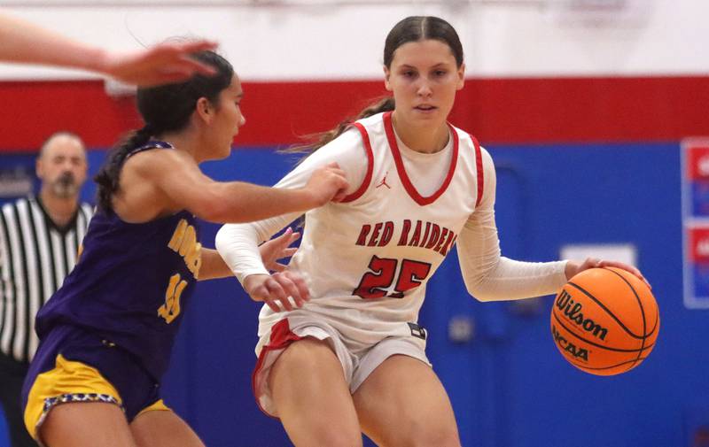 Huntley’s Evelyn Freundt moves with the ball against Hononegah in girls basketball at Dundee-Crown High School in Carpentersville on Tuesday, November 25, 2025.