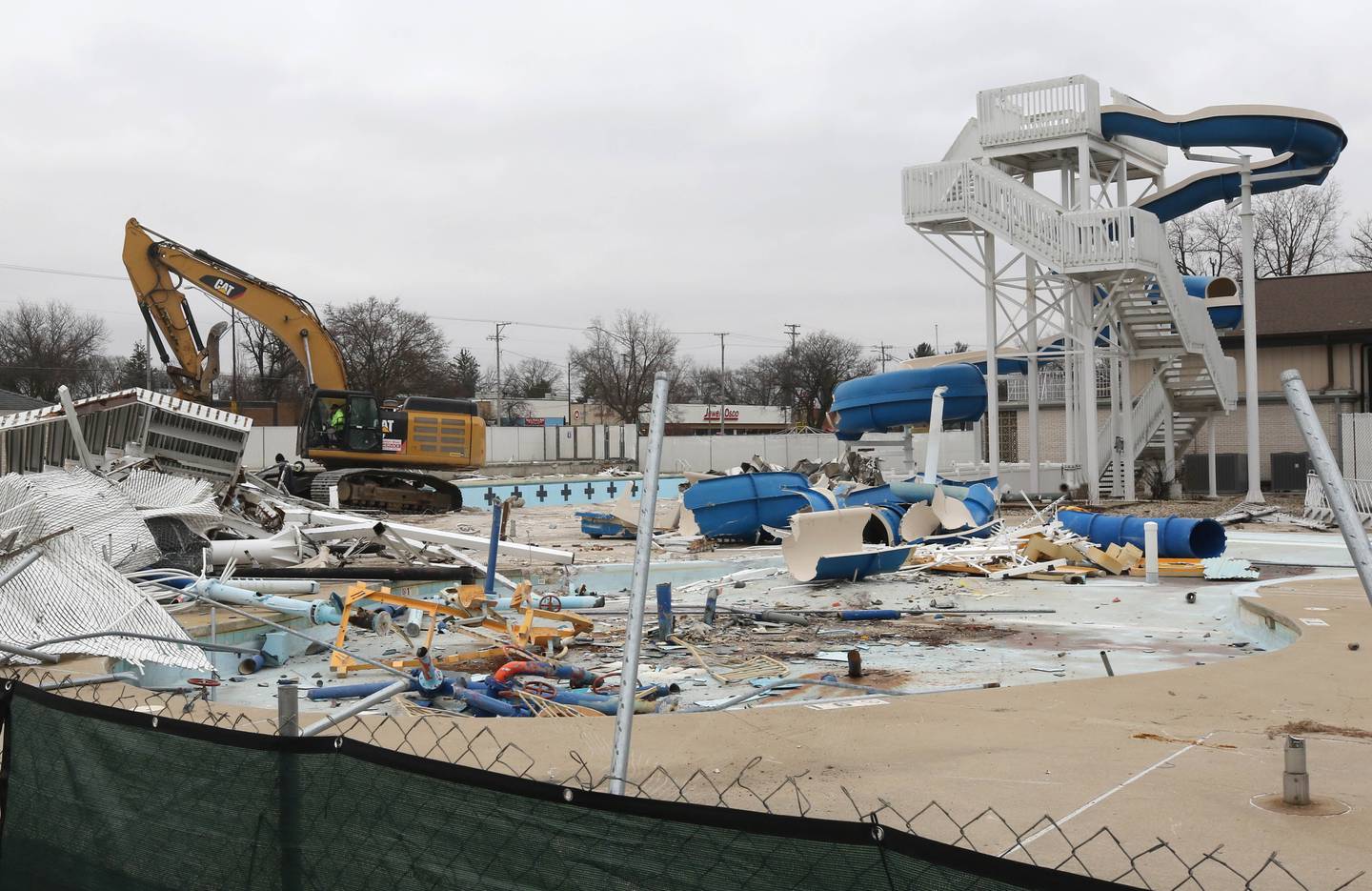 Demolition continues at Hopkins Pool Tuesday, December 10, 2024, in preparation for construction of a new pool set to open in 2026 at Hopkins Park in DeKalb.