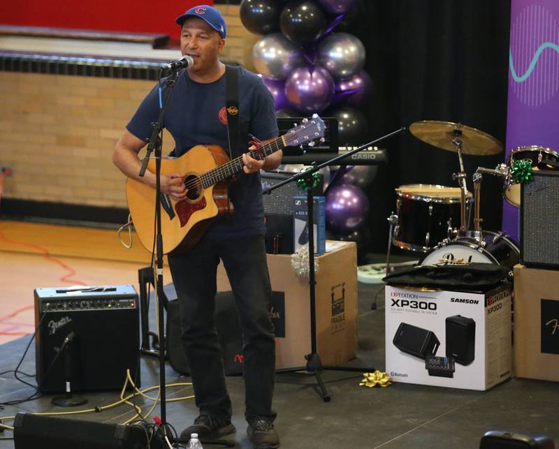 Tom Morello performs to students at Marseilles Elementary School on Thursday, Nov. 30, 2023. Morello is best known for his tenure with the rock bands Rage Against the Machine and Audioslave. Morello grew up in Marseilles before making it to the major music industry.
