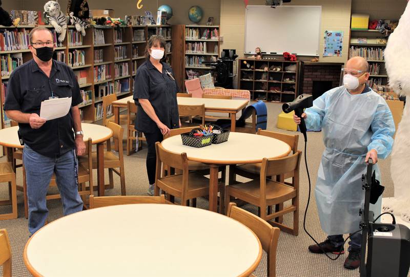 Troy custodians Mike Bloch, Laurie Harrison and Arjohn Servande keep Troy Heritage Trail Elementary School sanitized during the Covid-19 pandemic.