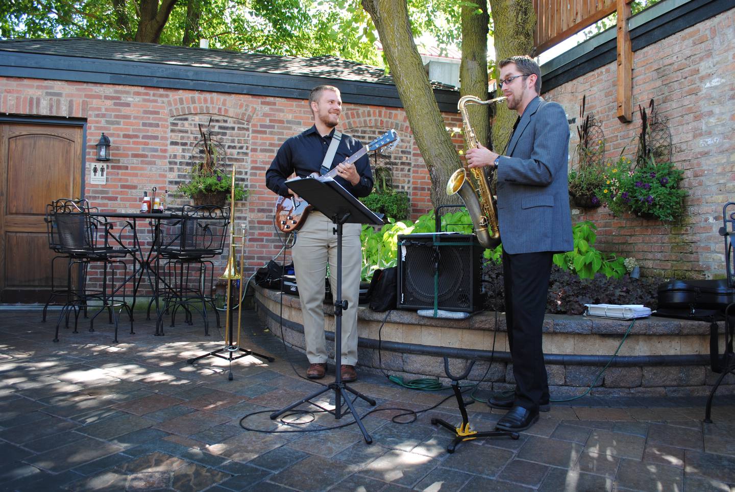 Kevin Brown, left, smiles as he plays a jazz tune with Andy Schlinder at The Office in St. Charles on Saturday afternoon. Their performance was part of St. Charles Jazz Weekend. (By Nicole Weskerna – nweskerna@shawmedia.com)