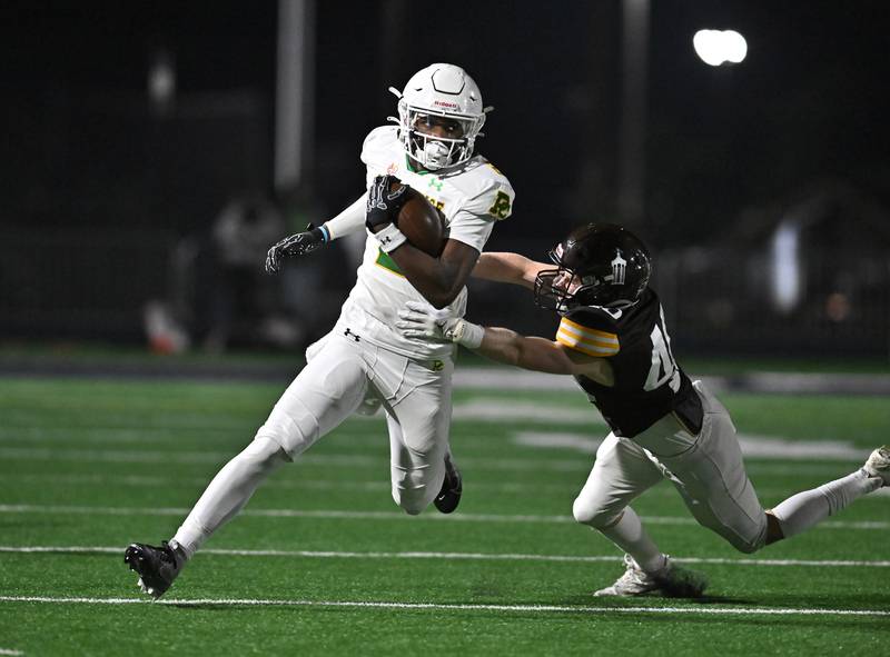 Providence Catholic's Xavier Coleman (2) eludes Joliet Catholic's defender during the conference game on Friday, OCT. 24, 2025, at Joliet.