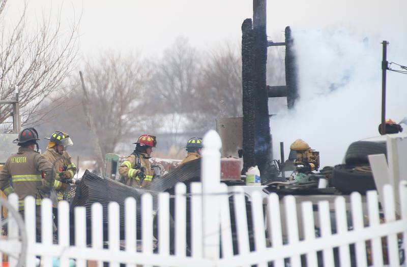 Firefighters work the scene of a structure fire in the 4000 block of East 16th Road on Thursday, Feb. 5, 2026 near Earlville. Fire departments from Serena, Mendota, Troy Grove and others were dispatched shortly after 12p.m. to the fire. The fire was upgraded to the second alarm through the Mutual Aid Box Alarm System (MABAS 25) shortly after.