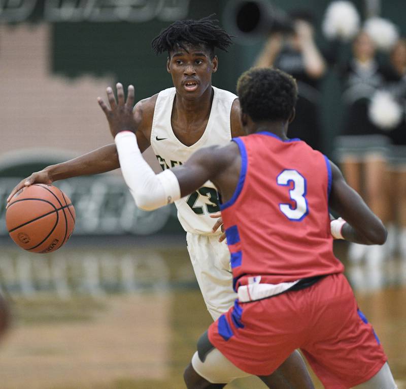 John Starks/jstarks@dailyherald.com
Glenbard West’s Benji Zander looks for a teammate against Glenbard South’s D'Manuel Payton in a boys basketball game in Glen Ellyn on Monday, November 21, 2022.