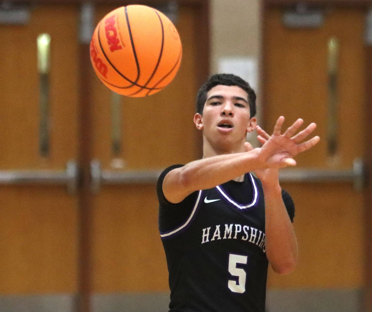 Hampshire’s Jordan Parish dishes the ball  in varsity boys basketball on Friday, Dec. 19, 2025, at Huntley High School in Huntley.
