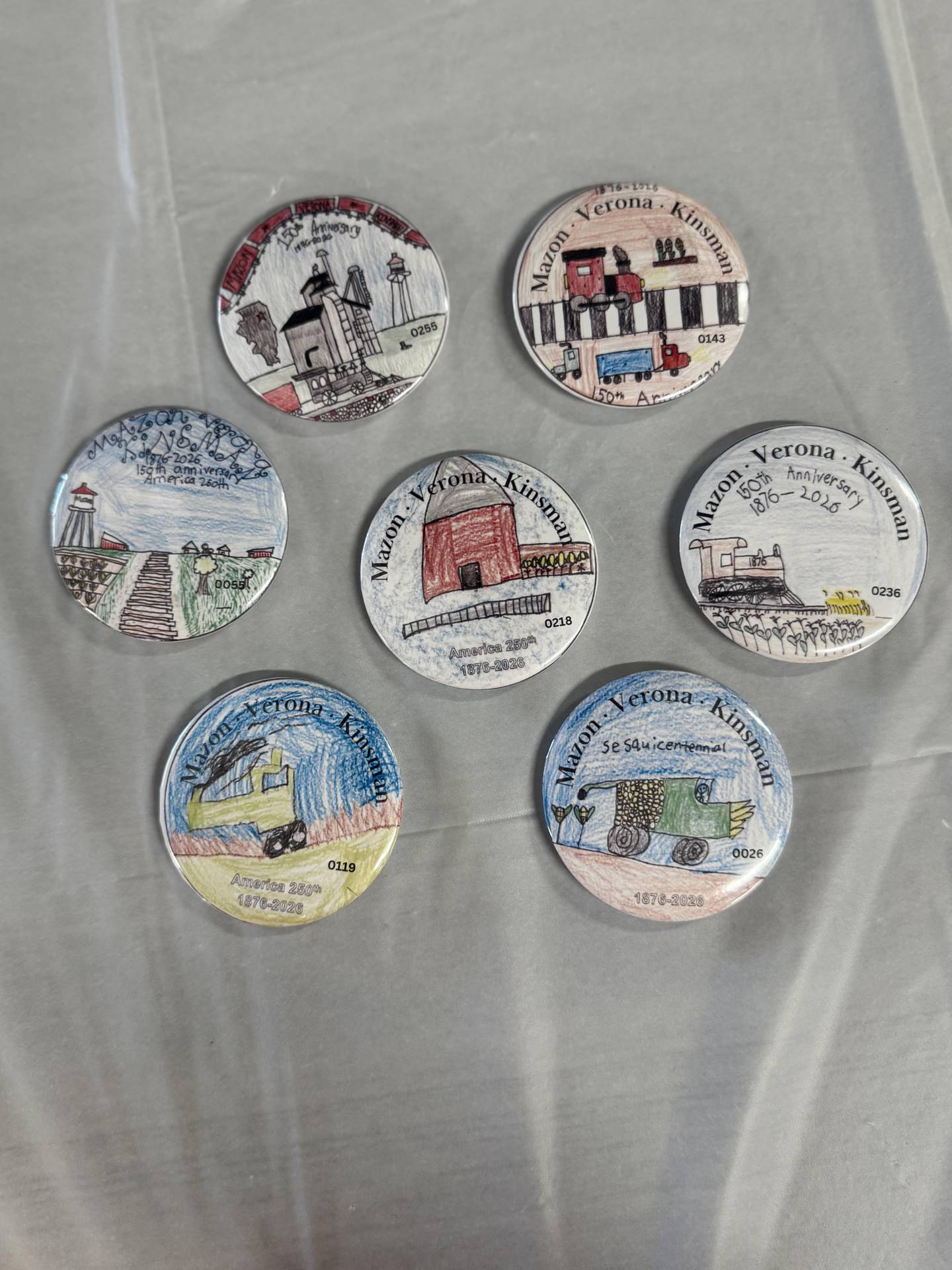 The winning button designs for the Mazon Sesquicentennial Celebration.