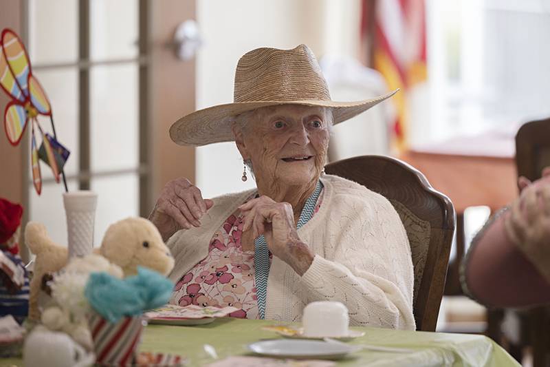Dolores Gapen waits for tea to be served at the start of the teddy bear tea party Friday, March 31, 2023 at Heritage Woods in Sterling.