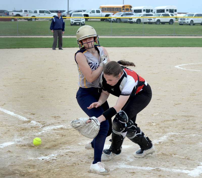 Polo's Cheyenna Wilkins scores a run as she collides with Forreston catcher Maddie Chesnek ahead of the throw to home plate during a Thursday, May 2, 2024 game at Forreston High School.