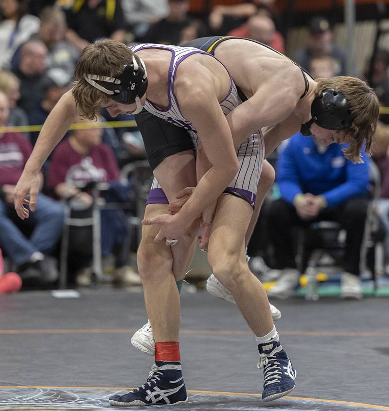 Dixon’s Jack Ragan (left) and Johnsburg’s Chase Vogel compete in the 120 pound first place match Saturday, Feb. 14, 2026, during the Class 1A wrestling sectionals in Byron.