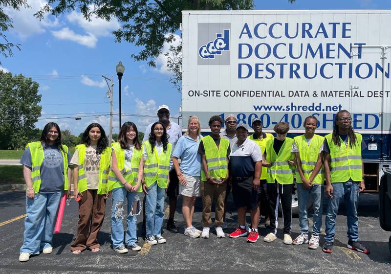 Pictured are shred and recycle event volunteers along with State Rep. Stephanie Kifowit, D-Oswego; Aurora Ald. Edward Bugg; and Derrick Hicks and Randy Ryder of AAMOU.