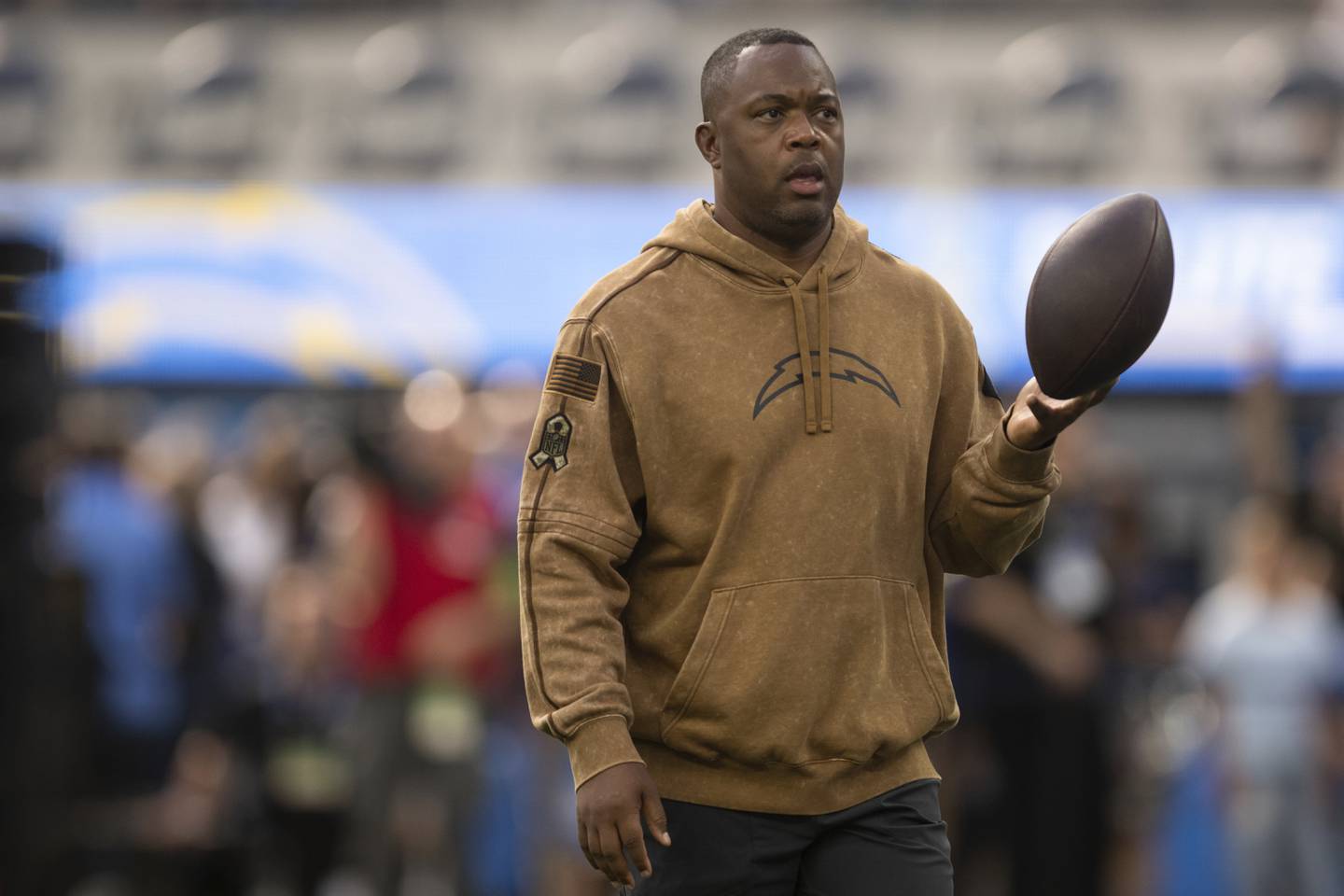 Former Los Angeles Chargers wide receivers coach Chris Beatty walks on the field before a game against the Detroit Lions, Sunday, Nov. 12, 2023, in Inglewood, Calif.