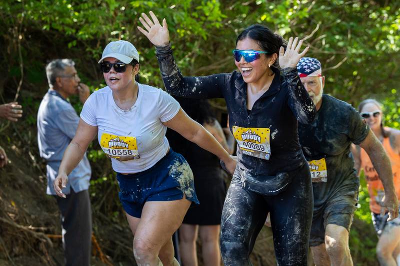 Participates of the 2025 Muddy Dash reach finish line in excitement on Saturday, June 28, 2025 at Fox Valley Off Road in Utica.