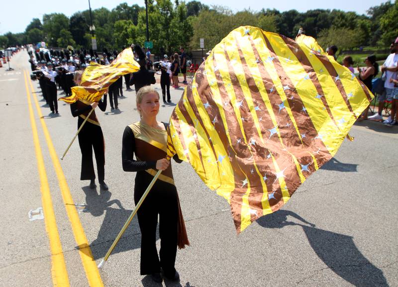 Jacobs’ High School color guard members march as part of the Founders’ Days parade along Route 62 in Algonquin Saturday.