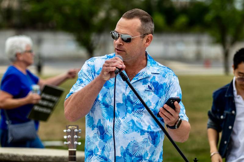 Bob Tate serves as emcee during the Good Trouble Lives On event in Downtown Joliet on July 17, 2025.