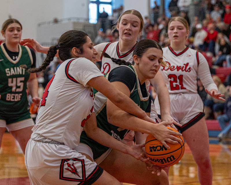 Hanna Waszkowiak (44) of St. Bede holds ball as Hall's Natalia Zamora (34) attempts to strip ball on Saturday, January 31, 2026 at Hall High School in Spring Valley.