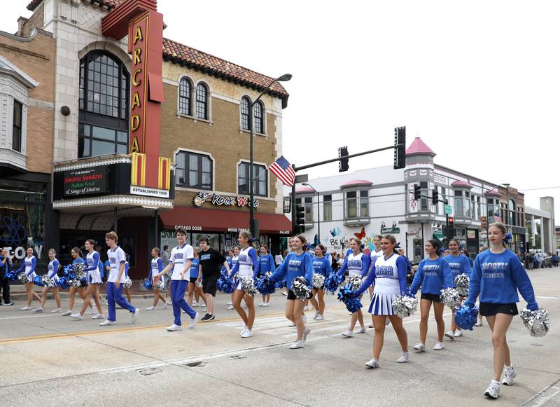 St. Charles North cheerleaders walk on Route 64 on Friday, Sept. 27, 2024 during the school’s annual homecoming parade in St. Charles.