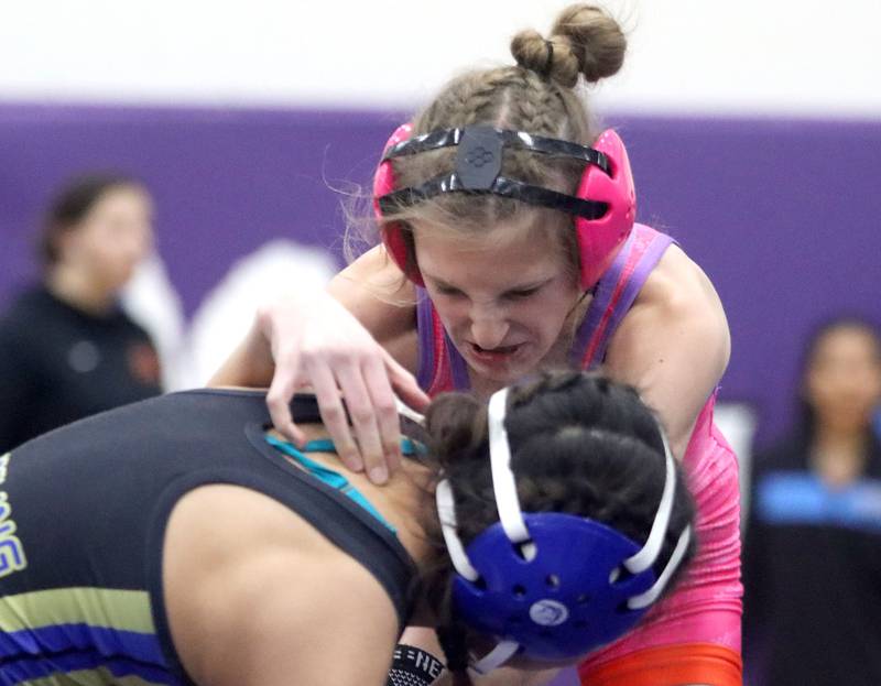 Woodstock’s Scarlet Splendora battles Wheeling’s Victoria Pina Rodriguez at 100 pounds in Whip-Pur Women’s Classic varsity girls wrestling on Saturday, Dec. 20, 2025, at Hampshire High School in Hampshire.