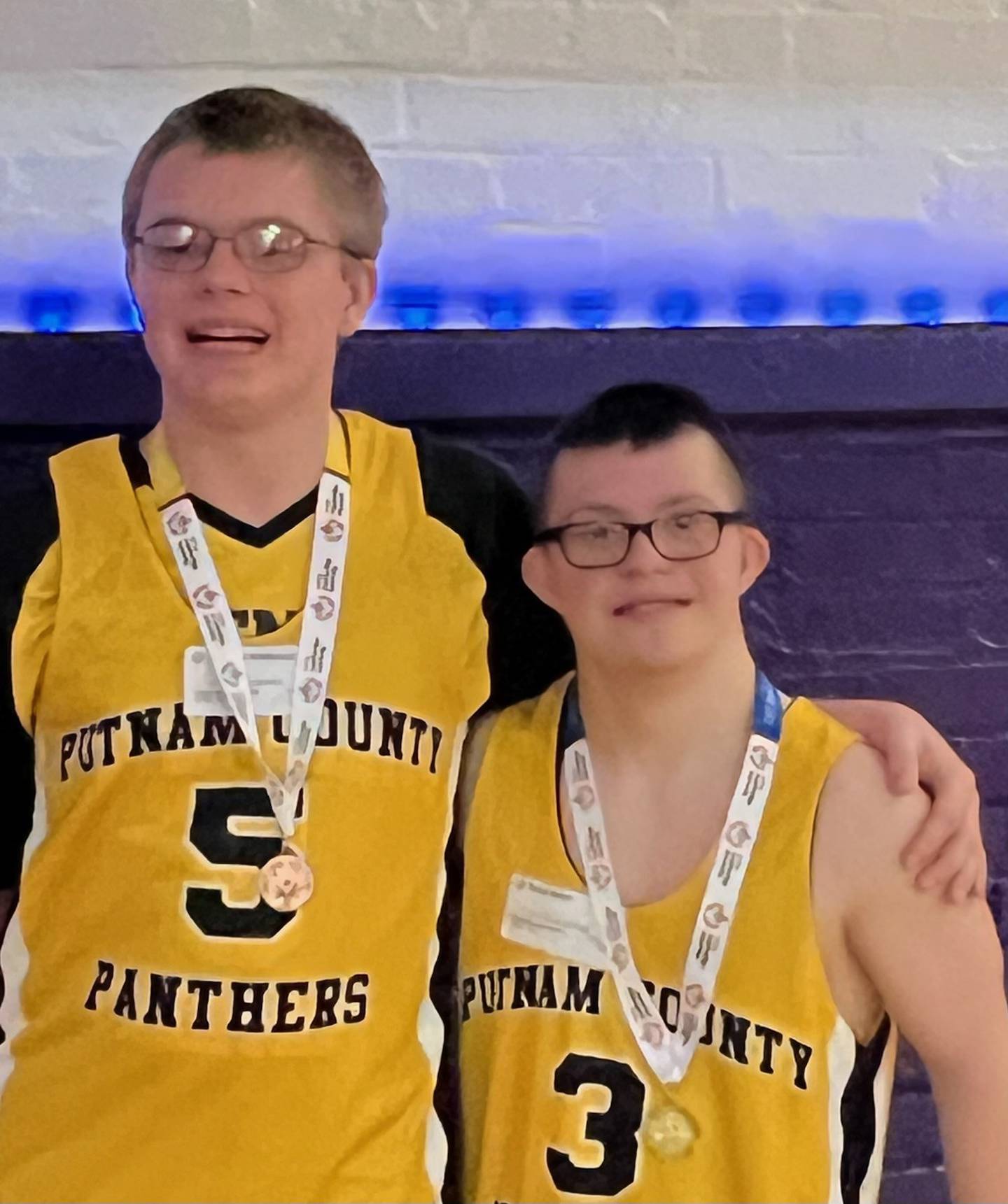Putnam County's Matthew Schennum (left( claimed a bronze medal and Blake Baker won the gold medal and in the Region 7 Special Olympics Basketball Skills competition at Dixon. Baker advanced to the State level in March.
