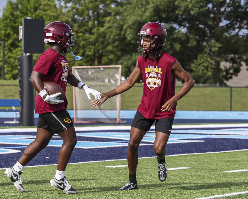 Montini's Izzy Abrams congratulates his receiver after a touchdown catch and run during the Downers Grove South 7 on 7 football tournament, July 12, 2025  in Downers Grove.