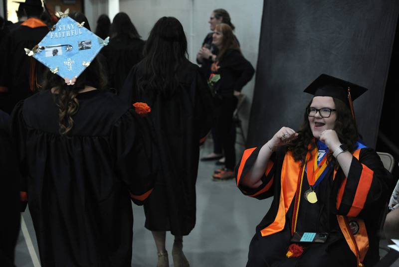 Sarah Dohert cheers for fellow graduates Saturday, May 21, 2022, during the McHenry High School’s 102nd Commencement Ceremony in the gym of the school’s Upper Campus. The ceremony was moved inside and split into two ceremonies because of the rainy weather.