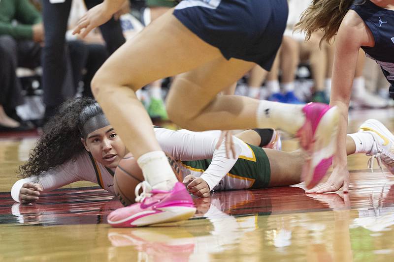 Waubonsie Valley’s Arianna Garcia fights for a loose ball against Nazareth Academy Friday, March 1, 2024 in the girls basketball 4A state semifinal at CEFCU Arena in Normal.