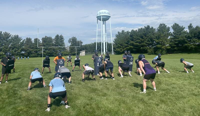 Members of the Bureau Valley football team run a play during camp on Thursday, July 24, 2025 at Hall High School.