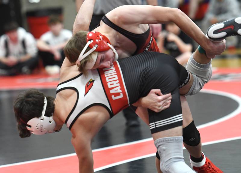 Amboy's Tyler Florschuetz lifts Stillman Valley's Xander Bell in the championship match at 126-pounds at the Stillman Valley Holiday Tournament on Saturday, Dec. 20, 2025 at Stillman Valley High School.
